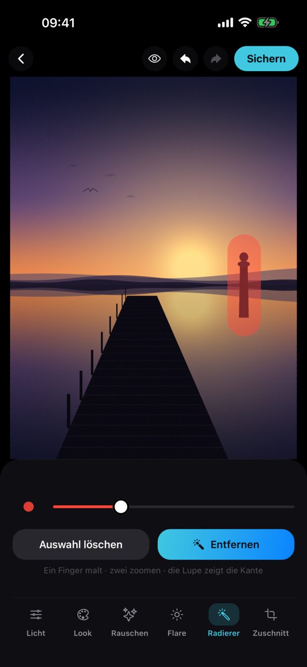Der Fotoeditor mit dem Radierer: über einem Pfahl im Wasser liegt eine rote Maske, darunter die Schaltfläche „Entfernen".